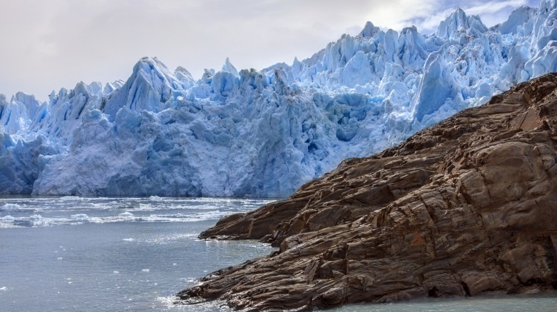 A hiker overlooking the stunning peaks and glacial lakes of Patagonia